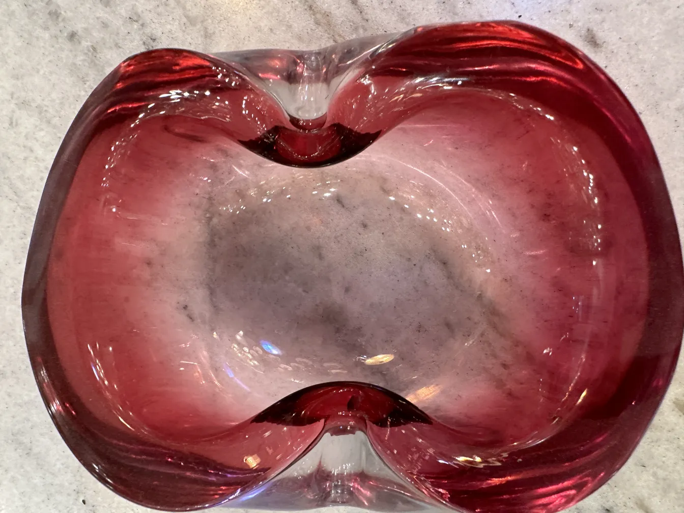 Antique Murano glass in red and clear colors with a fluid shape