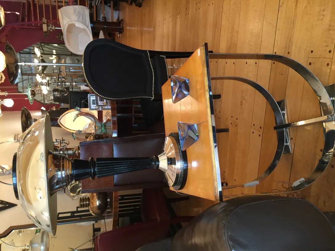 Antique Murano glass lamp with decorative base, surrounded by furniture