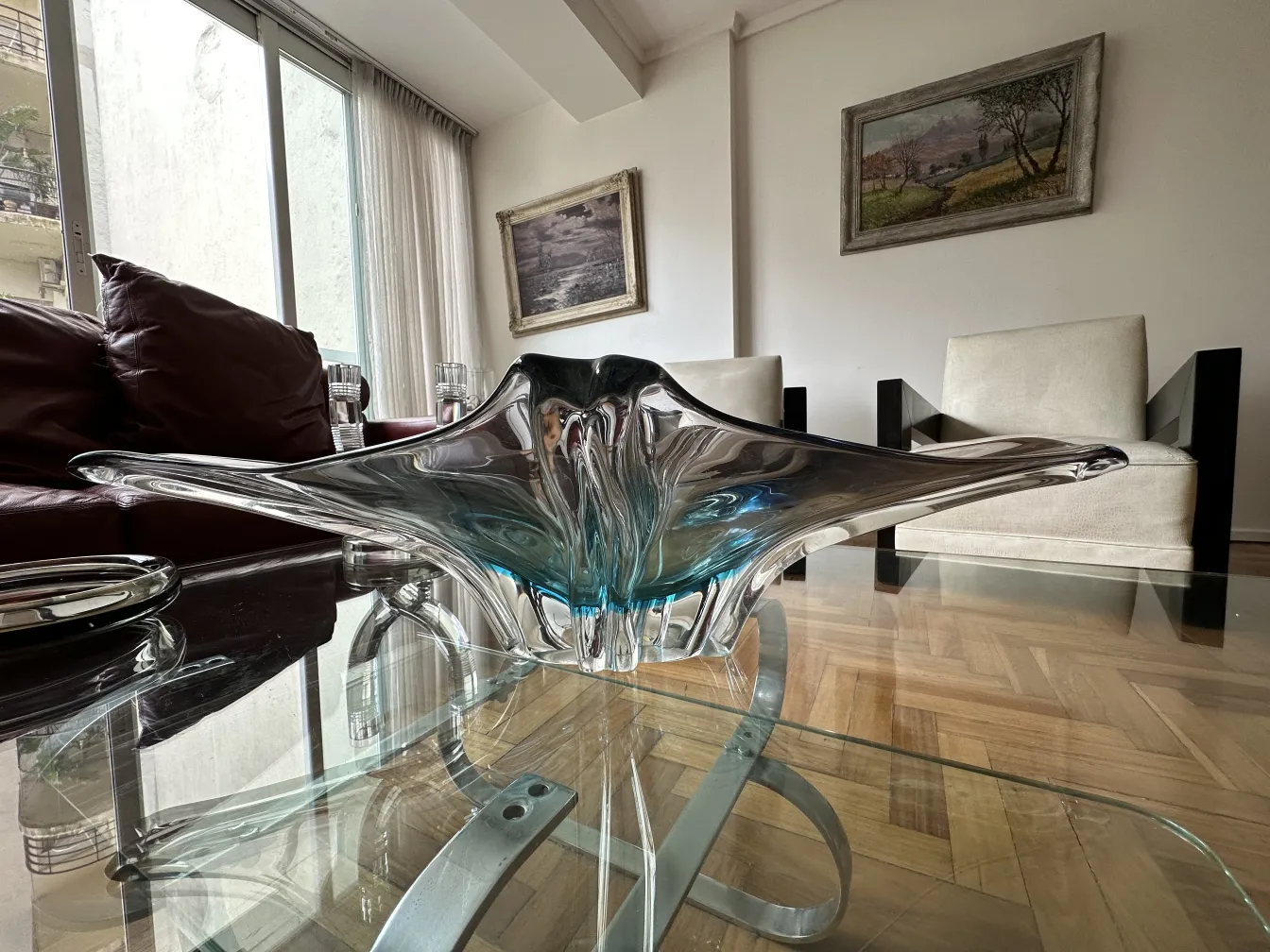 Beautiful antique Murano glass with blue tones and unique details, perfect for display.