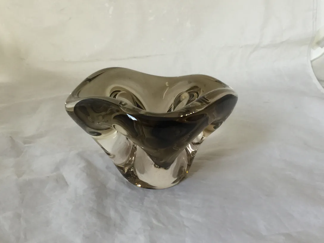 murano glass with fluid shapes and dark tones