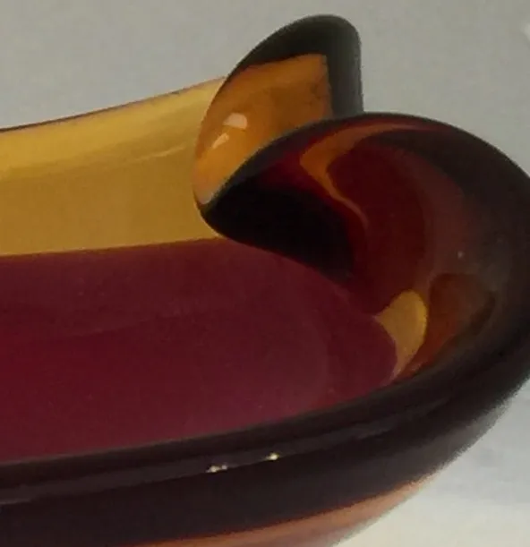 Antique Murano glass in colorful shades with elegant shapes.