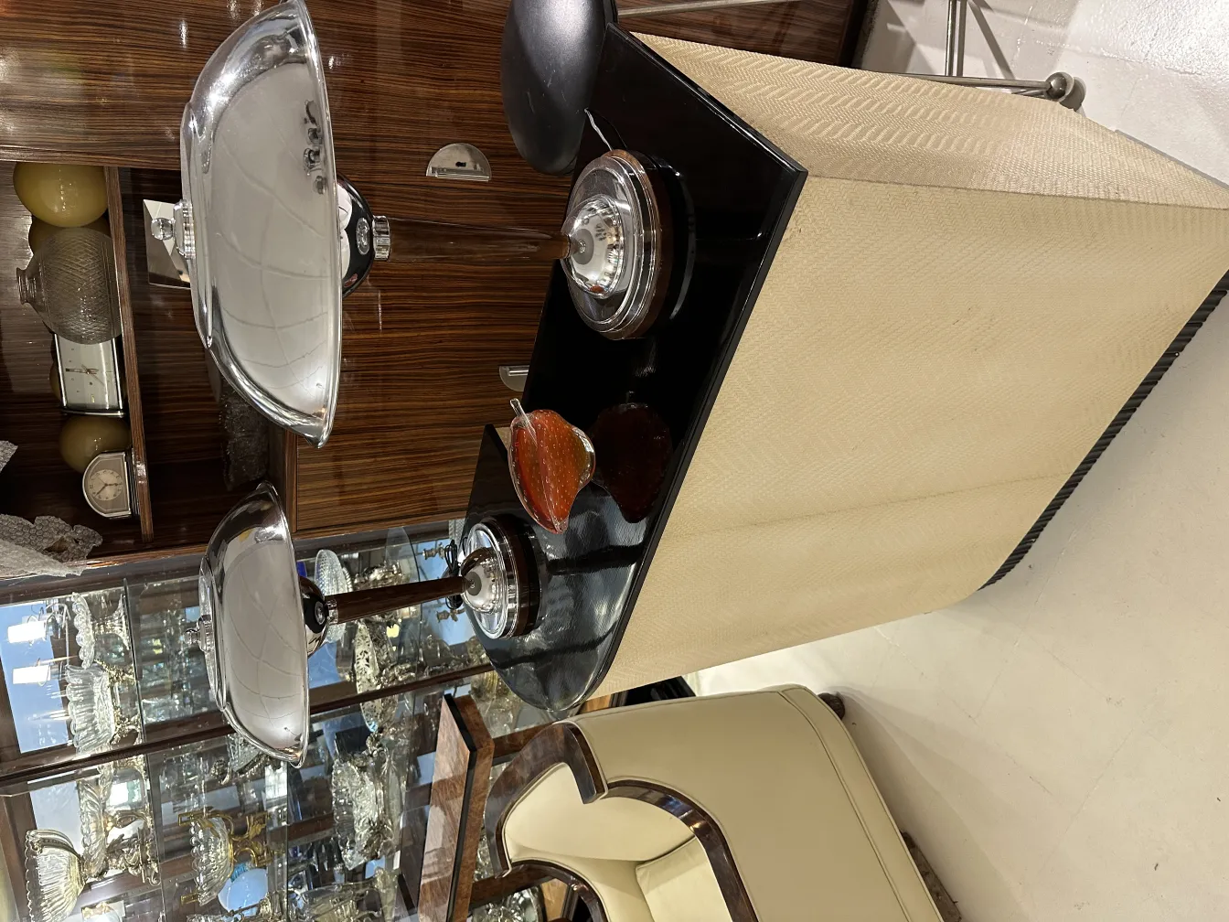 Antique Murano glass with decorative details in warm hues, showcased in an antique setting.