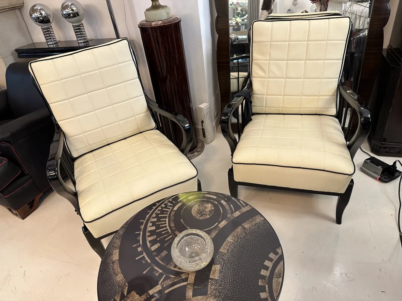 two vintage chairs with murano glass on the table