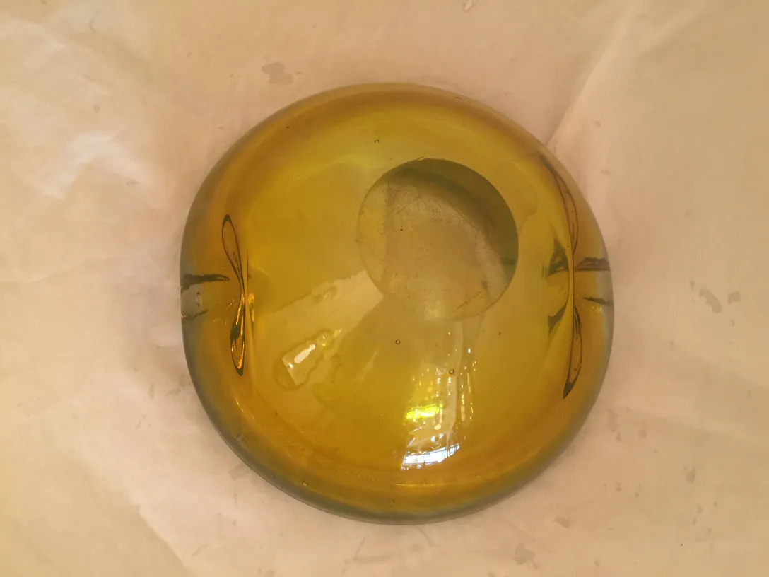 round murano glass piece in yellow with subtle decoration