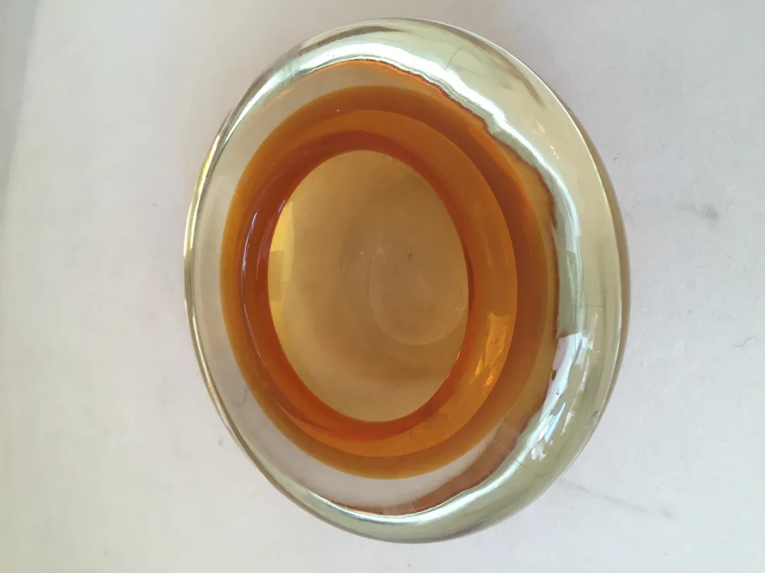 Murano glass bowl with amber and golden tones in an oval shape