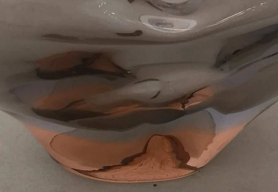 detail of an antique murano glass with copper reflections