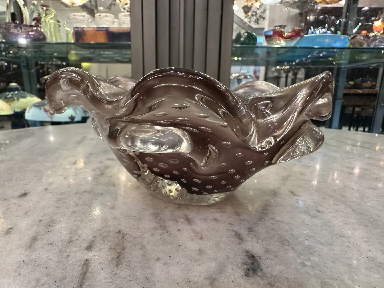 antique murano glass piece with wavy and dotted shapes, light background