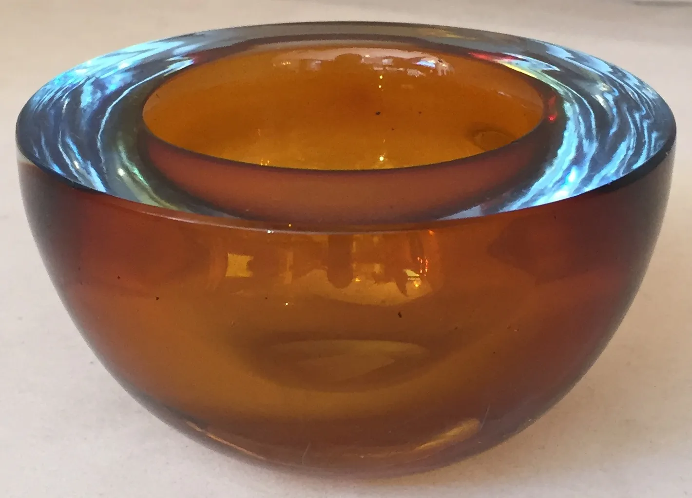 antique murano glass container in amber hues