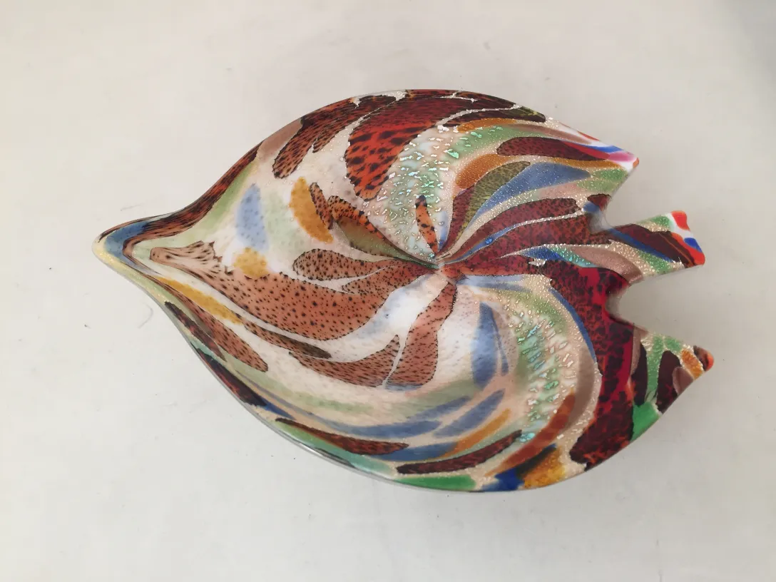 as seen, an antique murano glass with vibrant colors and unique shapes, decorative
