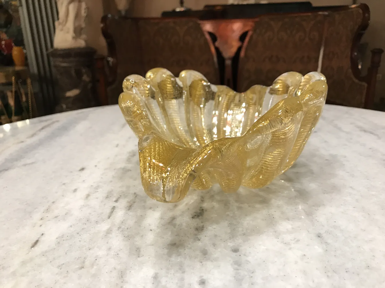 beautiful decorative murano glass piece with wavy shape and golden color
