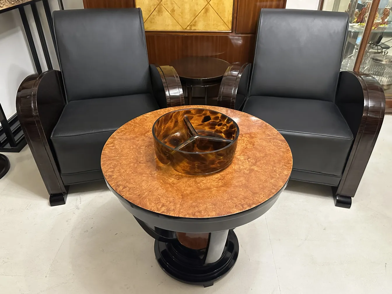 Decorative Murano glass on a table with armchairs