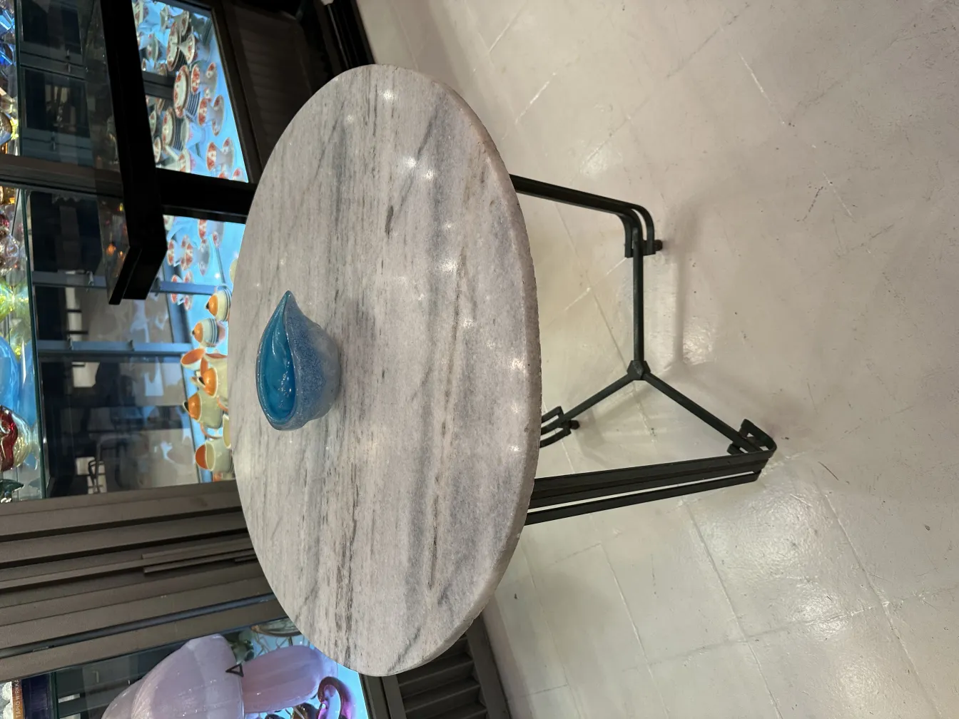 Antique Murano glass in a decorative shape with bright blue color.