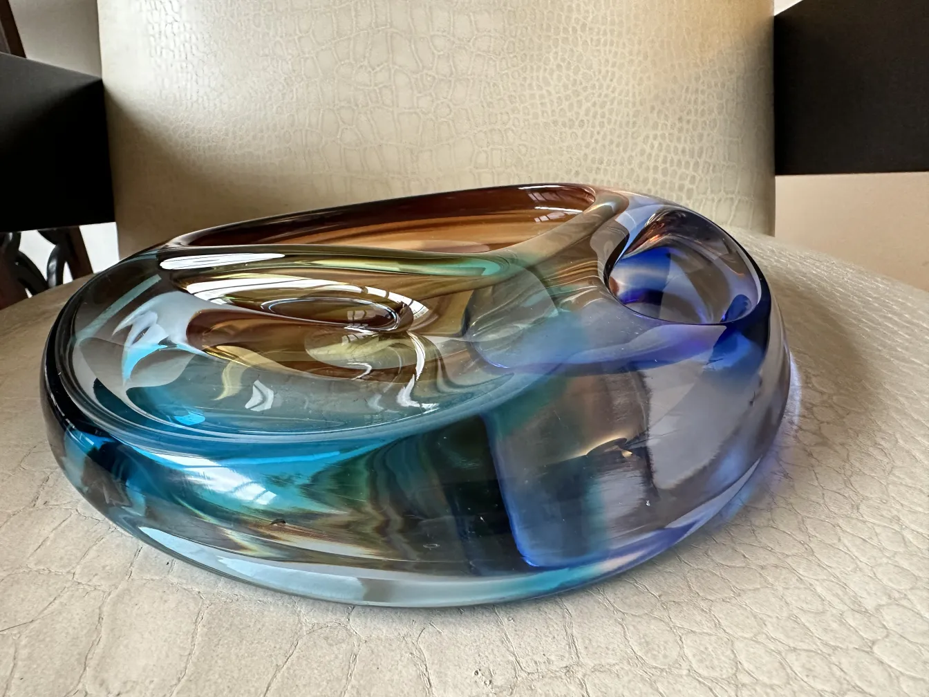 a beautiful murano glass plate with vibrant colors