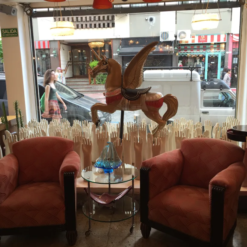 Antique Murano glass on a table with armchairs