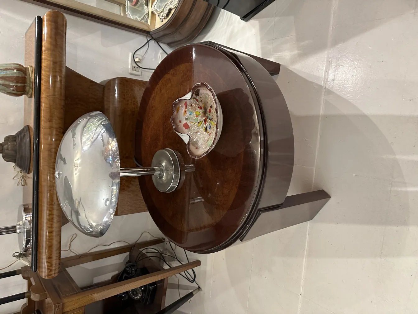 Antique Murano glass decorative piece with vibrant colors on a table.