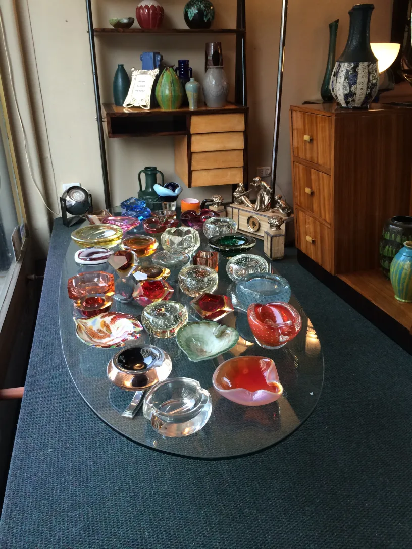various shapes and colors of murano glass on display