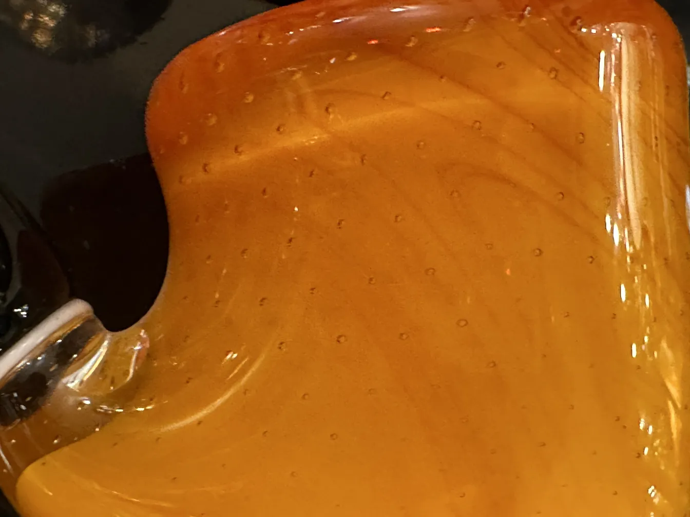 Antique Murano glass in amber color with bubbles