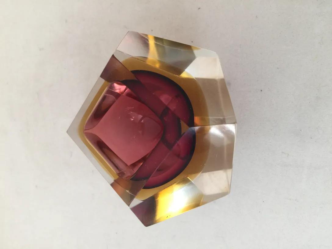 Antique Murano glass with red and gold tones, visible geometric shapes