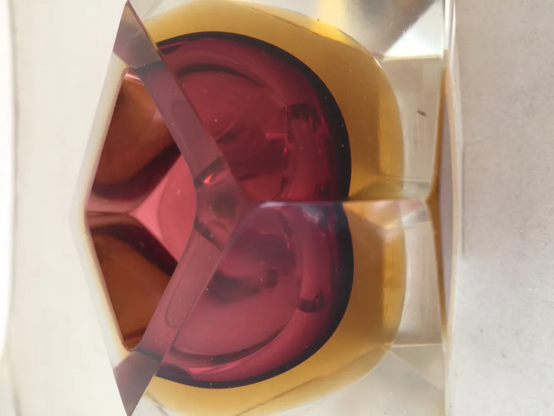 Antique Murano glass with red and amber tones, decorative.