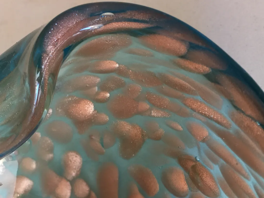 Antique Murano glass with colorful details and shiny surfaces