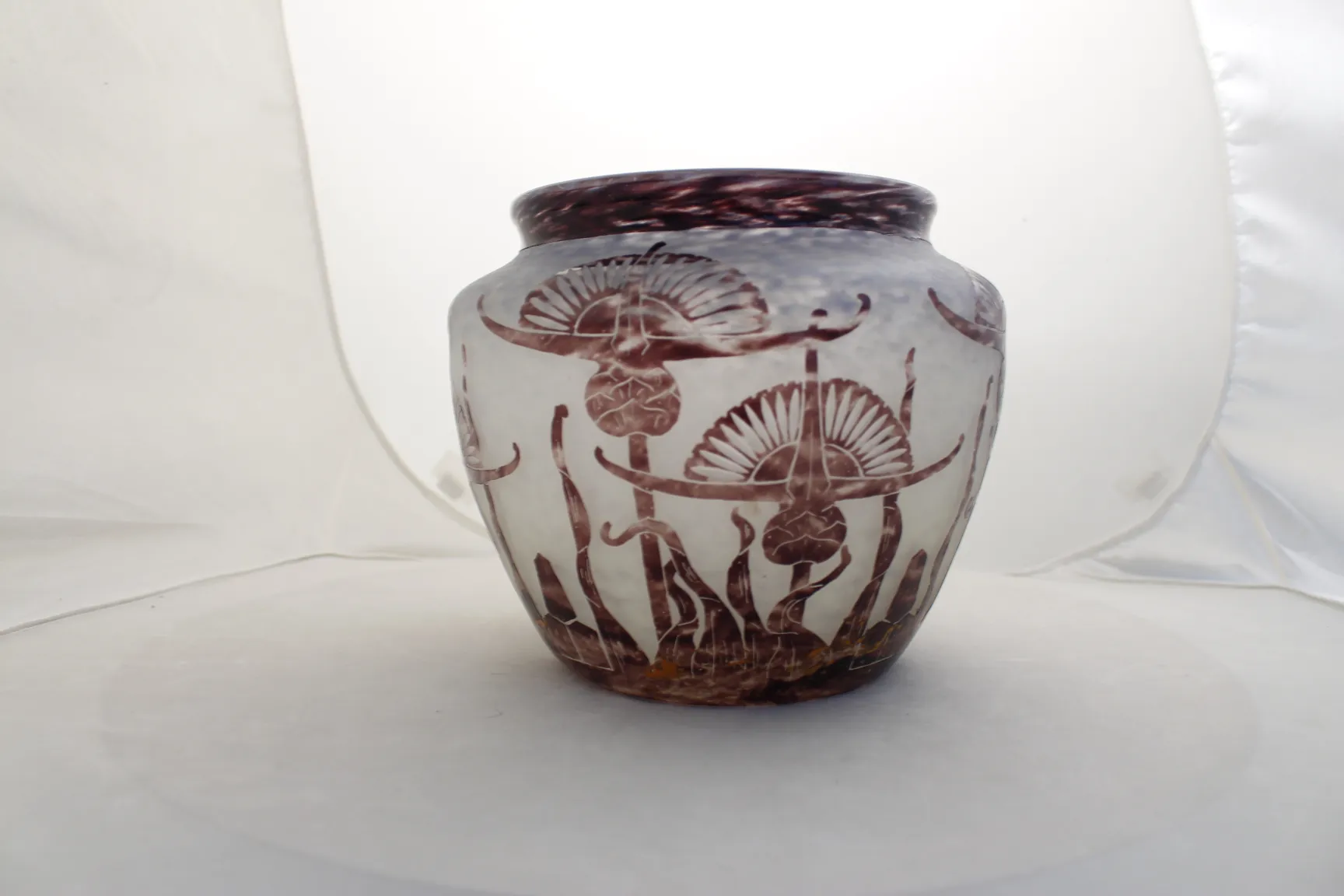 Glass jar with signature and floral relief designs