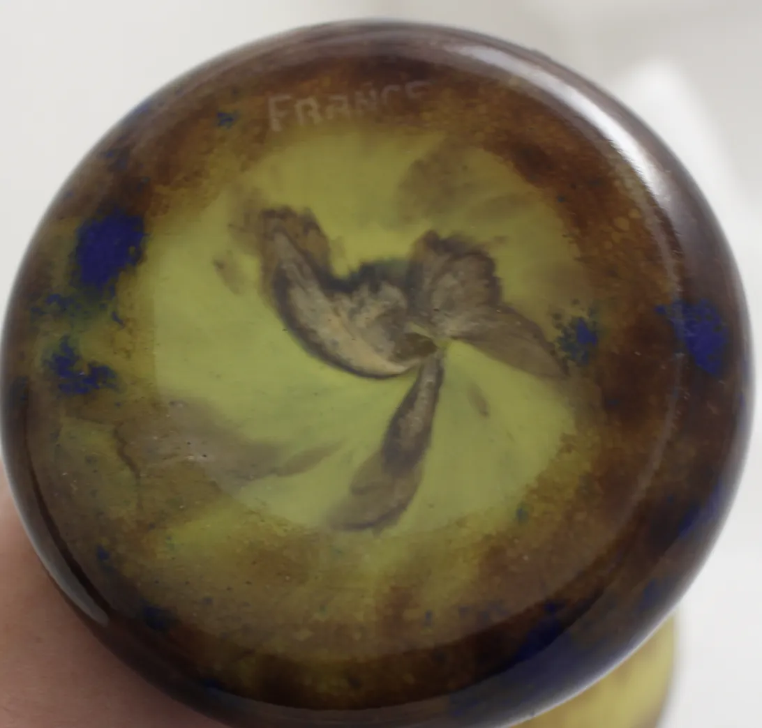 View of the base of a signed glass Le Verre, with green and blue shades.