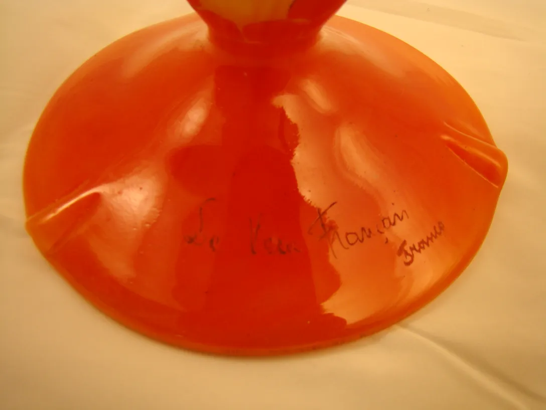 Antique signed glass with an orange colored base