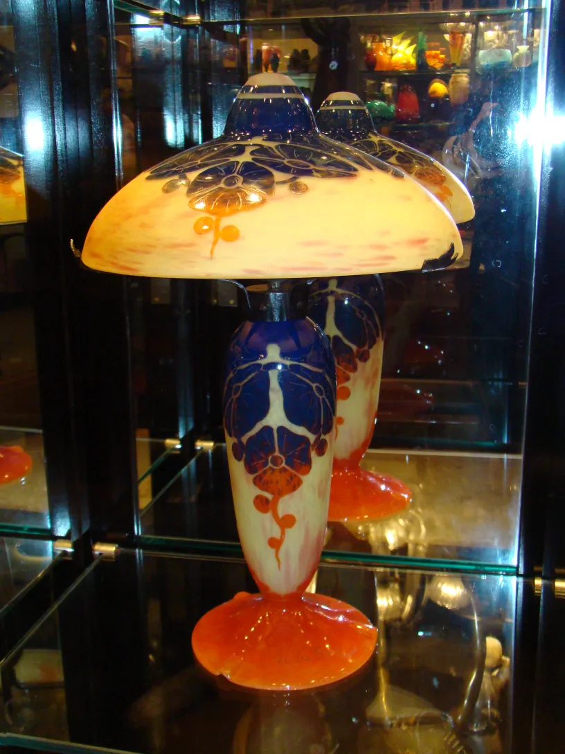 Glass lamp with floral decoration and orange base, antique.