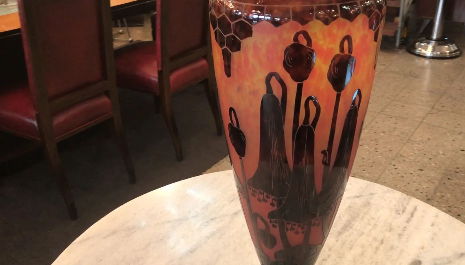 vase of signed glass with floral design in warm colors, antique from France