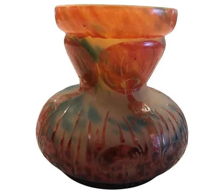 Decorative glass vase with colorful patterns, signed.