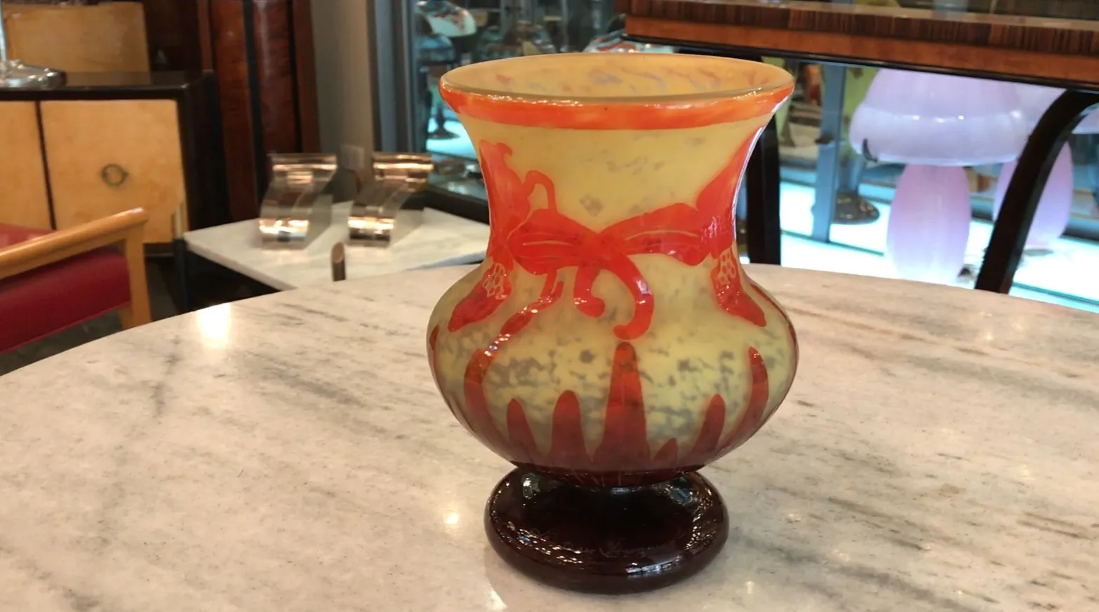 Antique glass vase with bright colors and ornamental designs.