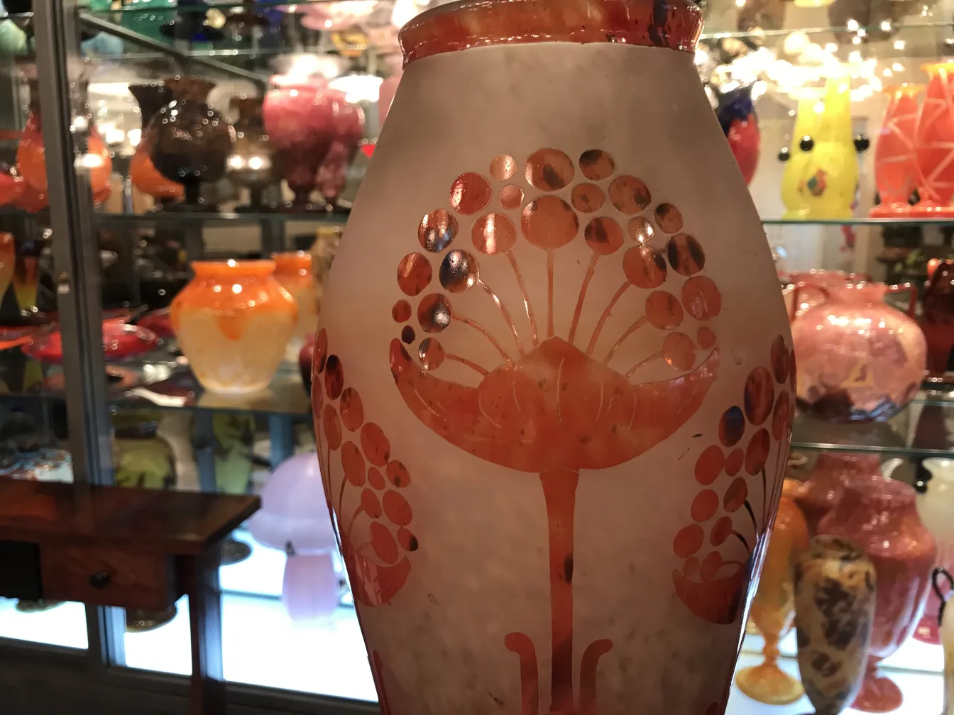 Glass vase with floral pattern in display case