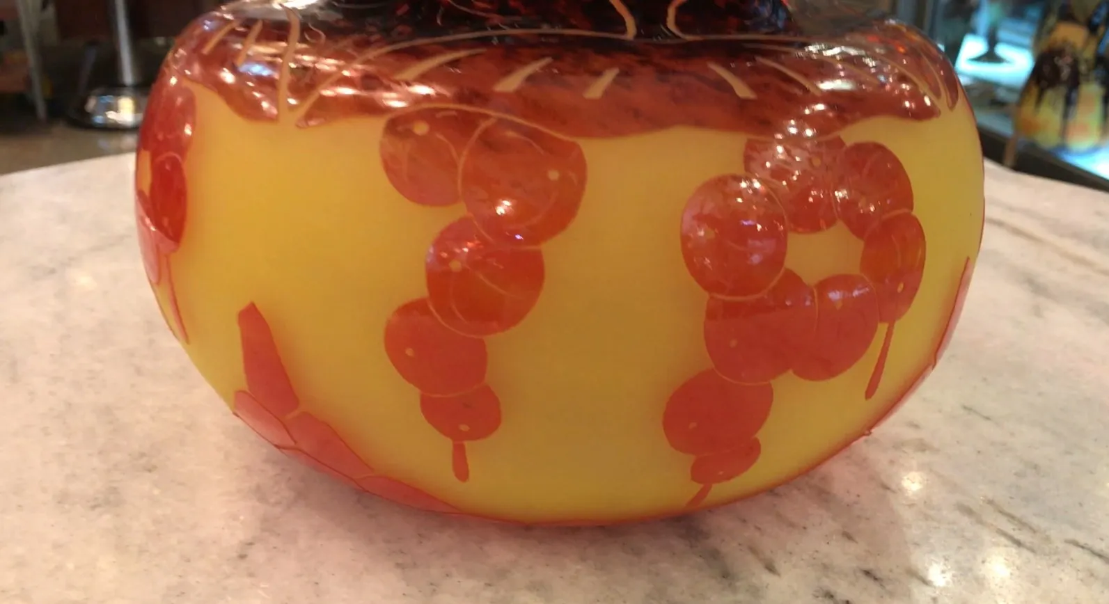 signed glass with colorful bubble-like designs