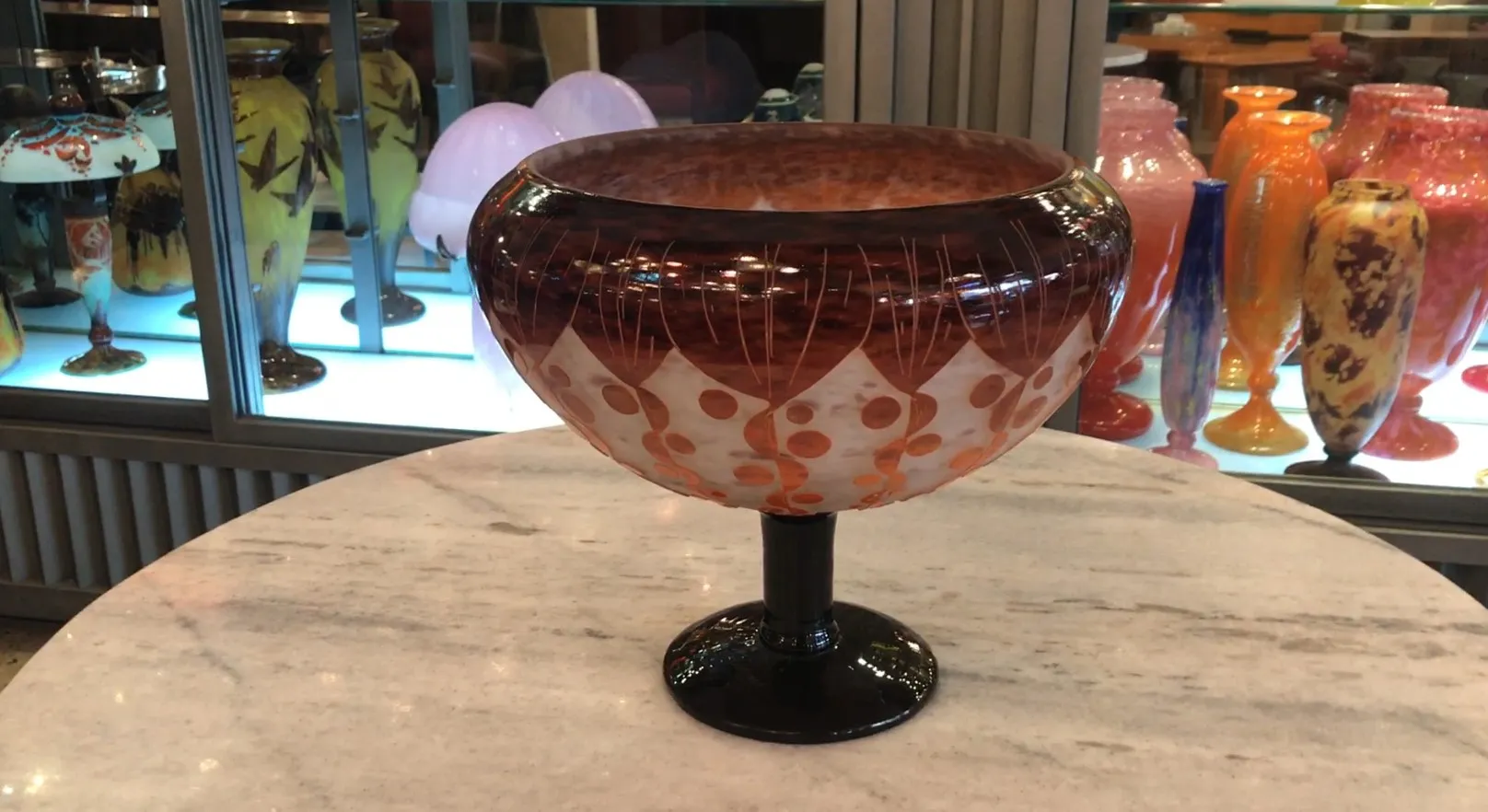 Antique glass bowl with an attractive design and vibrant colors.