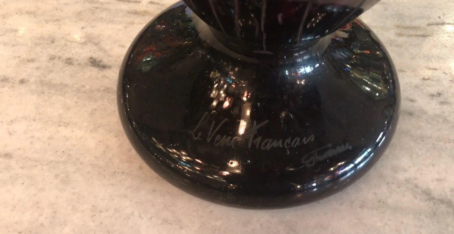 Antique signed glass Le Verre on light background