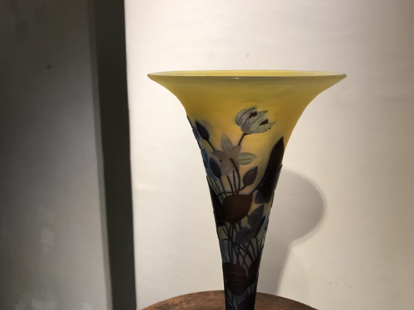 Antique conical glass featuring floral designs in tones