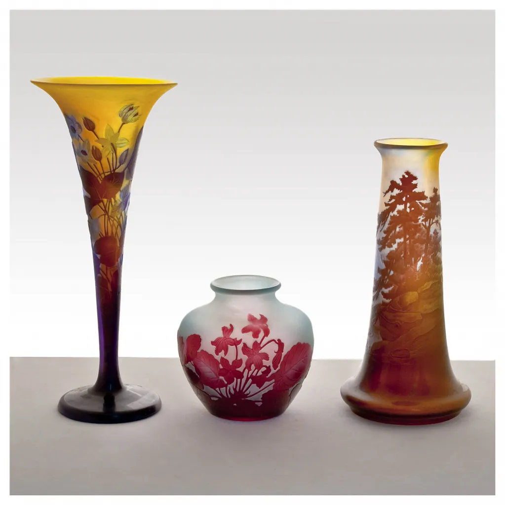 Signed Gallé glass vases in various colors with floral relief decoration