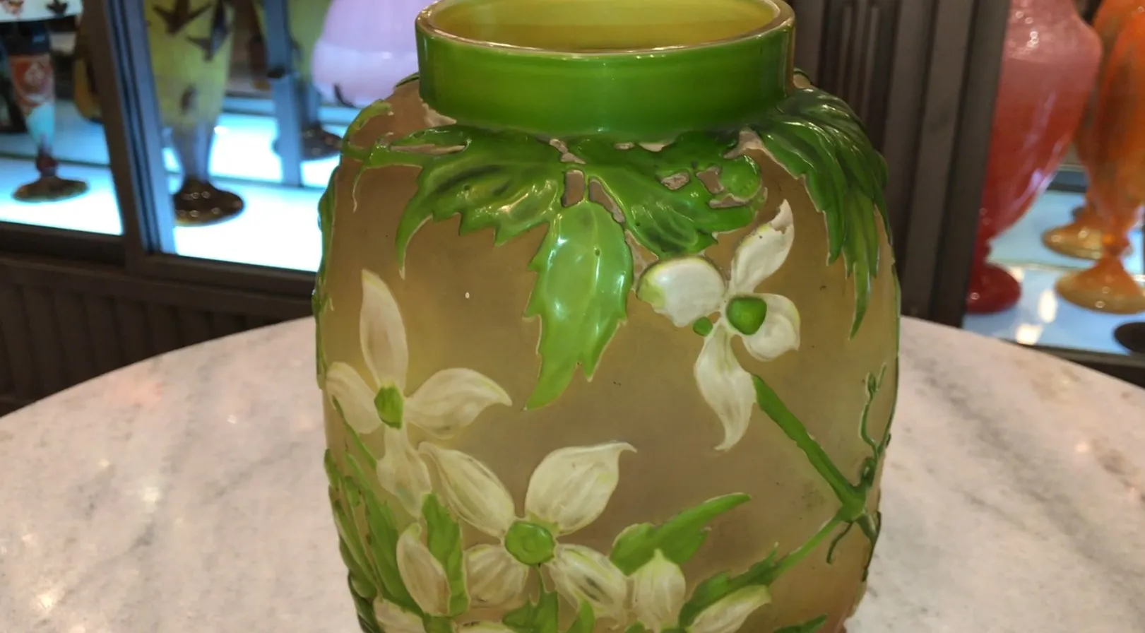 signed glass gallé featuring a green floral design