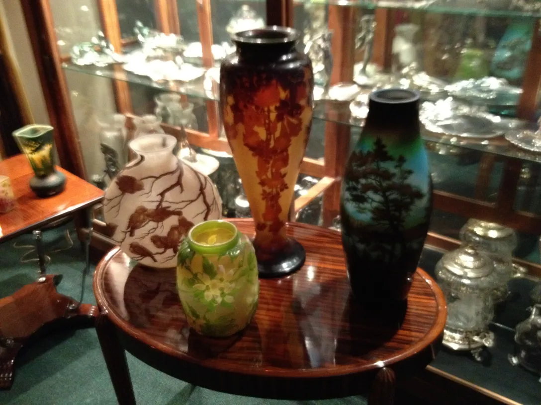 Antique decorative vases on display, signed glass Gallé.