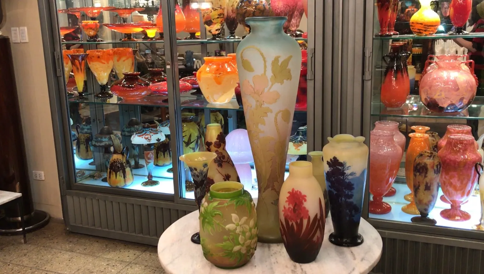 SIGNED GLASS Gallé in a decorative setting with other items