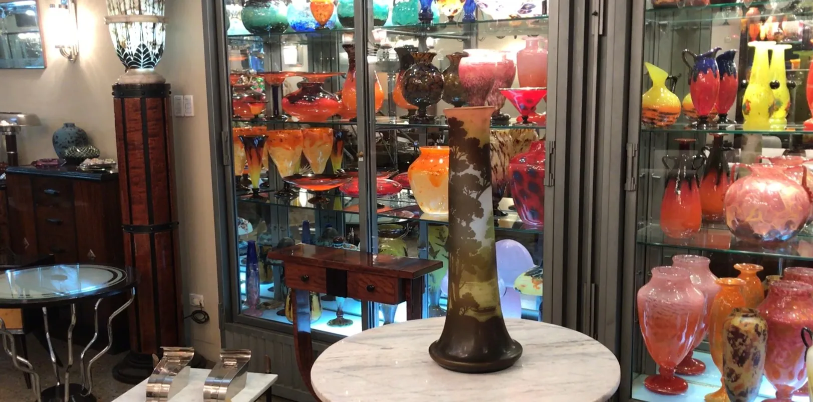 SIGNED GLASS Gallé surrounded by colorful antiques