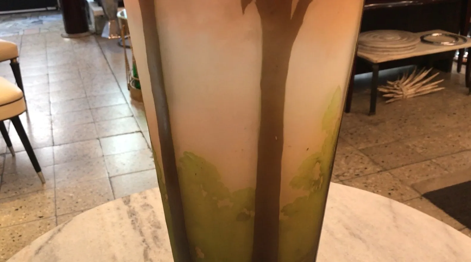 Signed Gallé glass featuring decorative design, soft background