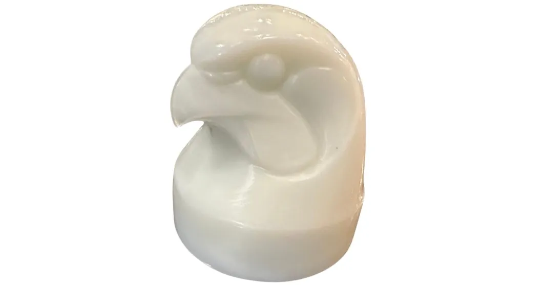 Signed glass shaped like a bird head in an antique design