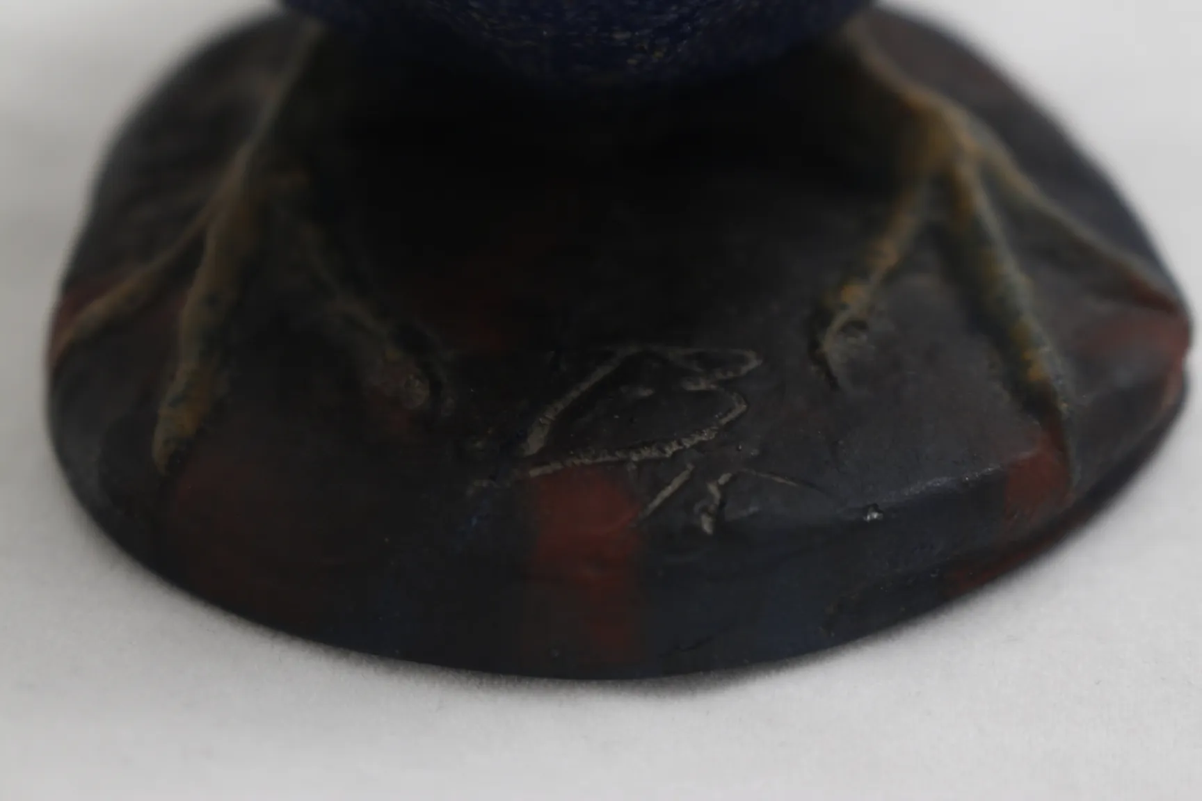 Base of a signed glass with visible details