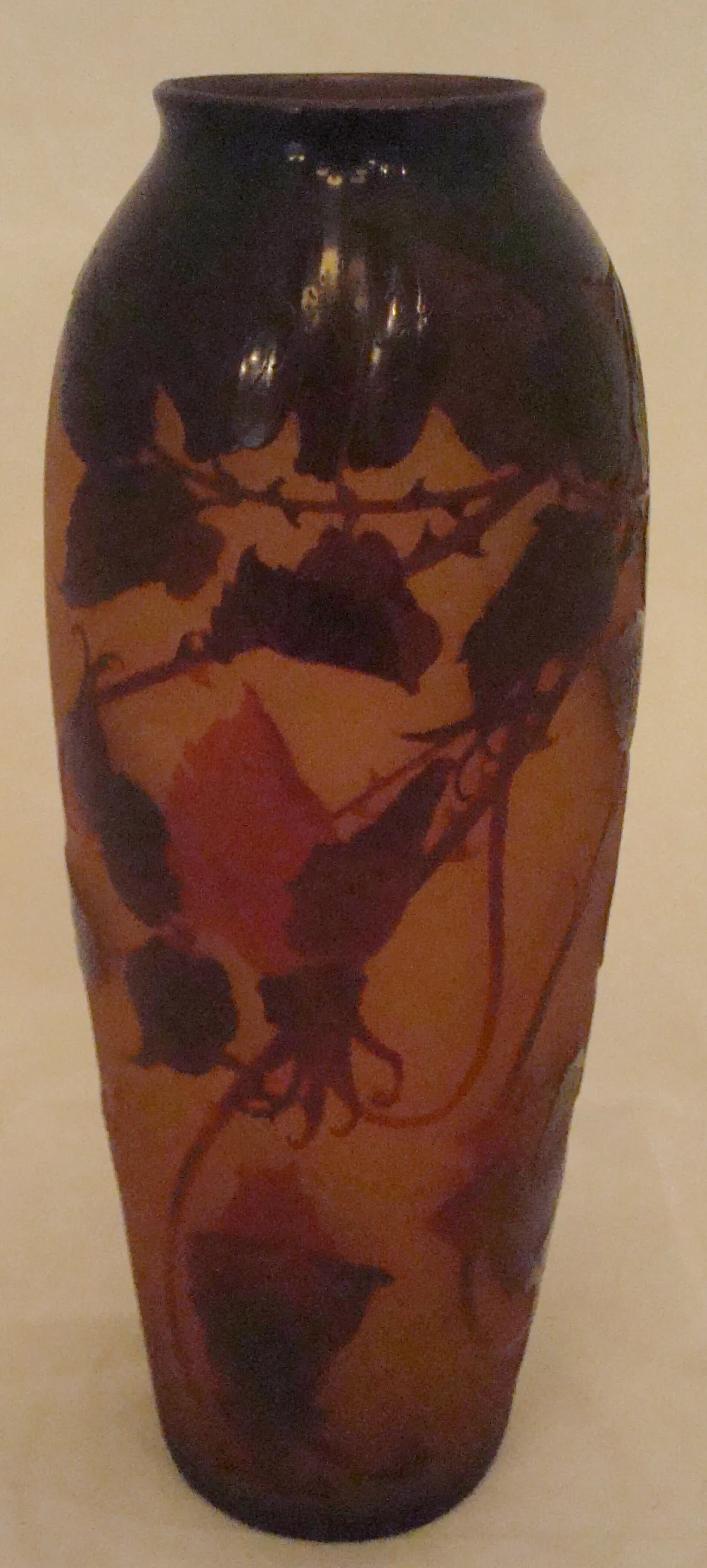 signed glass from d'argental with dark floral patterns