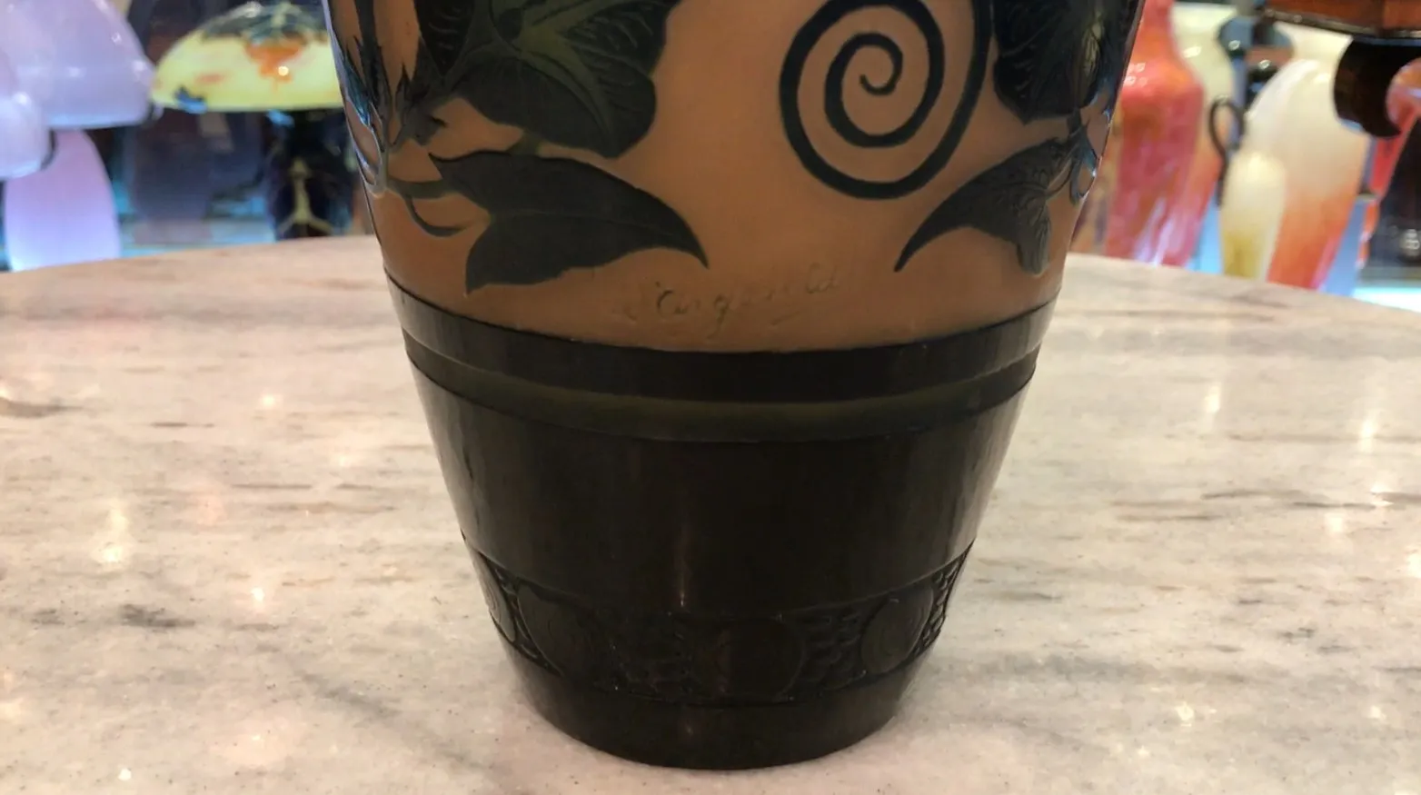 Decorative signed glass d'Argental with plant details.