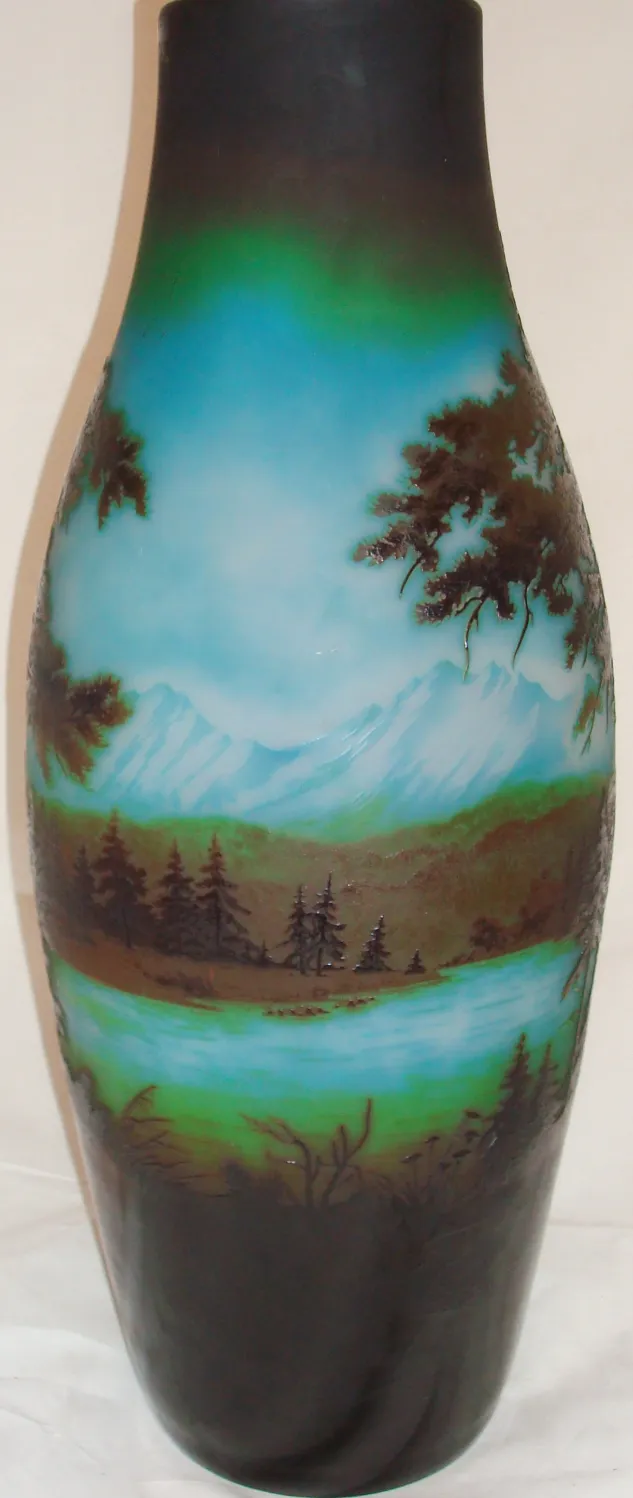 Signed glass D'Argental featuring a landscape of mountains and trees.