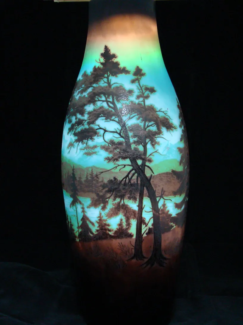 Signed glass D'Argental featuring a landscape of trees and mountains