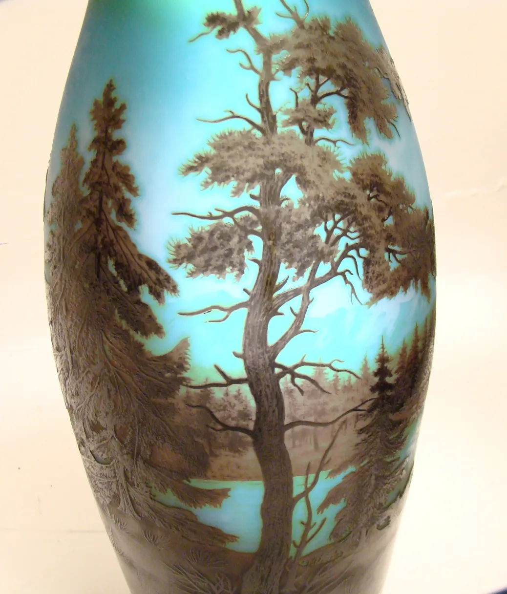 Signed glass featuring tree and water landscape, antique.