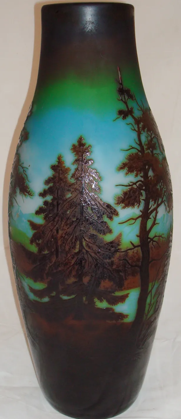 signed glass d'argental featuring a tree landscape